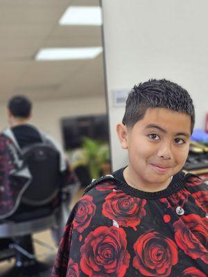 Low taper, line up, shear texture on top w/ fiber pomade