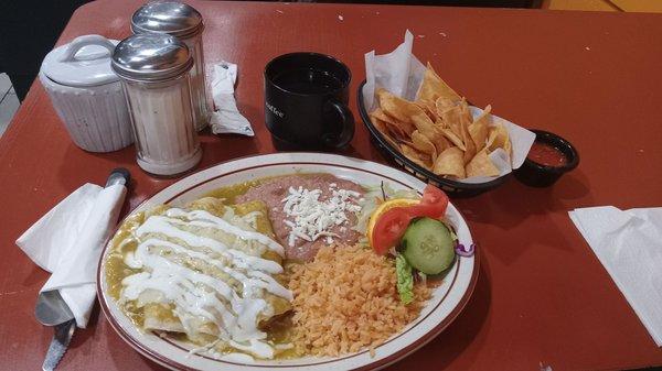 Enchiladas with beans and rice, coffee chips and then the garnish, but I always eat the garnish. Your choice of meat and sauce
