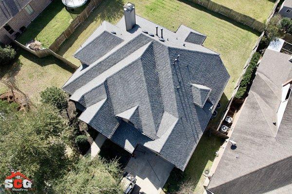 Aerial view of a fresh, high-quality shingle roof by SCG Roofing. Clean lines and flawless install.