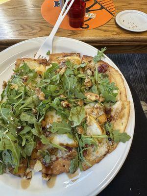 Flat bread with white sauce, Brie, apple, arugula, and balsamic glaze