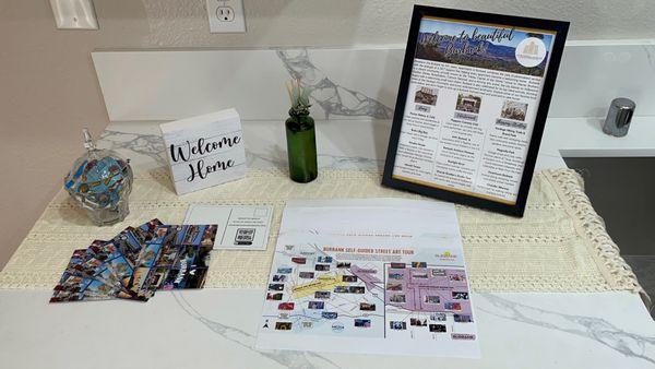 Visit out Welcome Table for Burbank-themed candy, art walk map, I 3 Burbank postcards, and local recommendations.