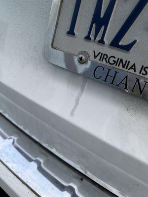Grey touch up on a white car