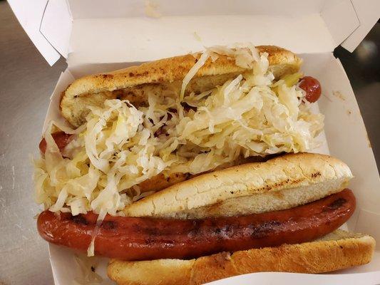 One dog with sauerkraut and one plain