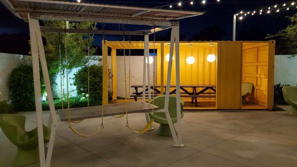 "Carnival" dining patio area. Swing while you enjoy your meal.