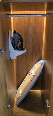 Iron and ironing board in the closet