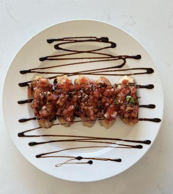 Bruschetta | House made crostini topped with fresh tomato, basil, olive oil, red onion & balsamic reduction.