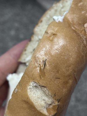 1. Close up. No matter how I looked at it, it looked like hair. I am guessing the baker just cut hair and it fell into the dough.