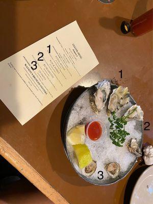 Photo of 2 Royal Miyagi, 2 Kumamoto, and 2 Olympia oysters.