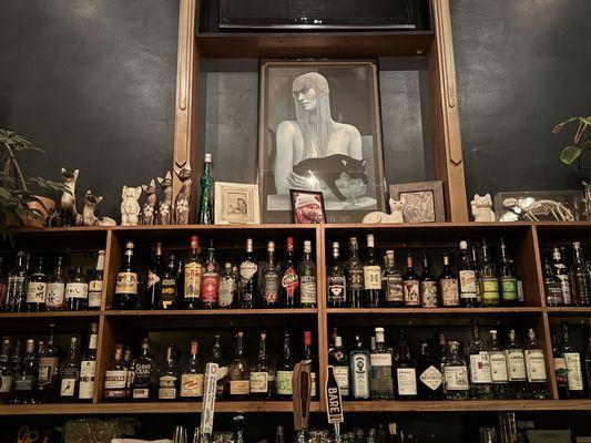 Cat House altar of booze and felines.