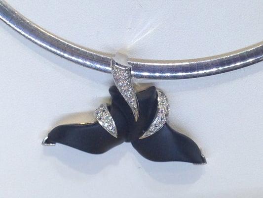 Hand carved onyx whale tail pendant