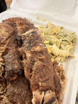Jerk chicken, rice and peas with rasta pasta