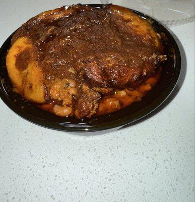 Waakye stew with stewed fish