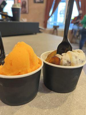 Mango x cherry water ice and two scoops of cookies n cream ice cream topped with caramel and sweet plantains