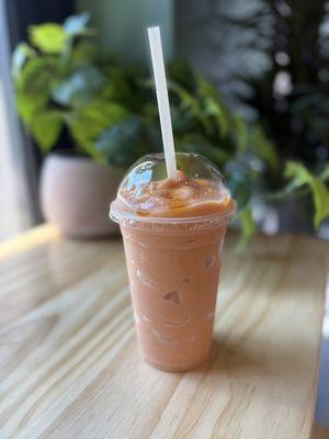 Caribbean Dream smoothie with peaches, mango, strawberries and passion fruit inside.