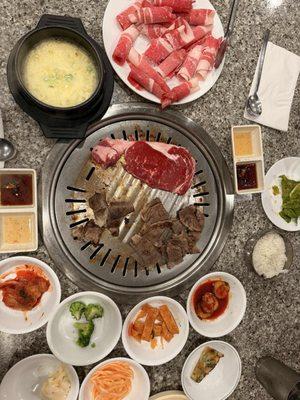 Rib eye, brisket, egg and side dishes