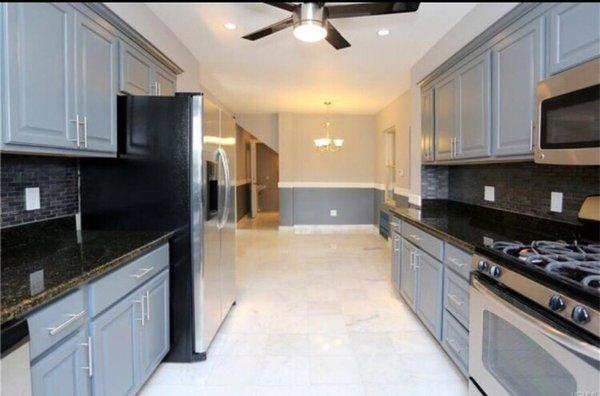 Another view of the kitchen with marble floors