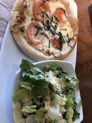 Five Cheese Pizza with Tomatoes and a Salad.