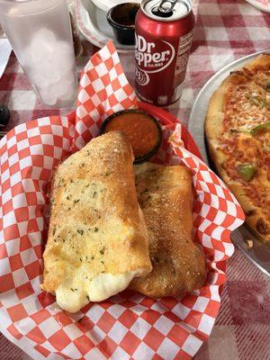 Stromboli with pepperoni and one can drink combo.
