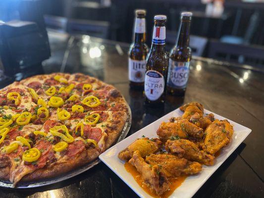 One price Build Your Own Pizza, a side of wings....and yes, a cold beverage!