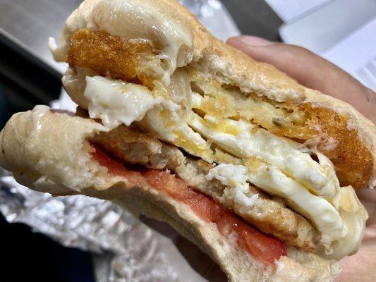 Sausage egg and cheese. Tomato and fried onion.