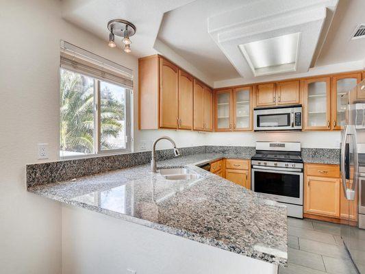 Gorgeous Upgraded Kitchen with view of the backyard!