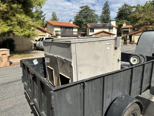 My old AC unit being sent off to retirement after 19 years of service. Its replacement, from Great Dane, is much nicer and brand new!