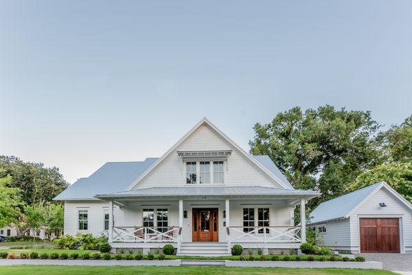 This custom build, with its clean lines, thoughtful details, and inviting front porch, is a perfect example of craftsmanship.