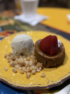 Caramel cake with vanilla ice cream and macadamia nut crumble