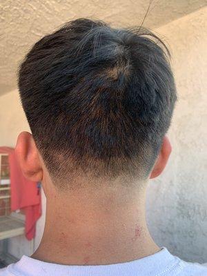 Super botched haircut, uneven, and even got a few cuts from the shave on his lower neck.