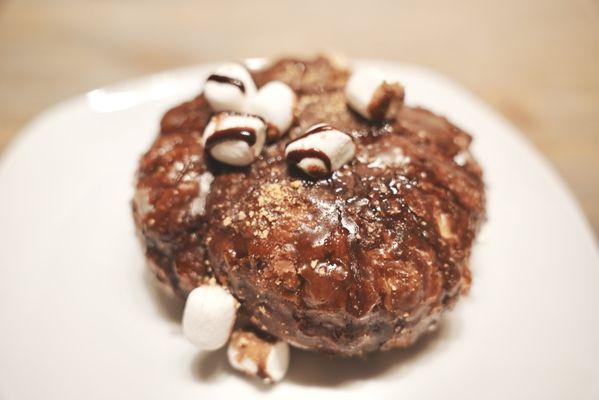 Campfire Doughnut. Marshmallows, chocolate drizzle, and crushed graham crackers. The inside is incredibly soft and pillowy!