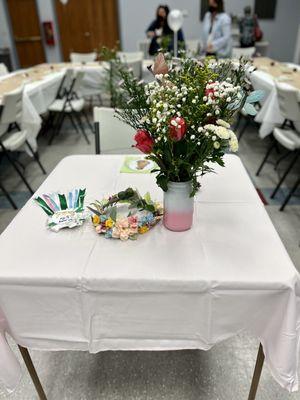 This gives an idea of the table and chairs they provide. The tables are white, they look great!