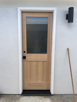 New bathroom/exterior door with frosted privacy glass. New trim as well!