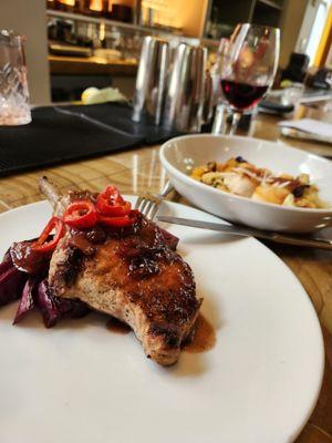 Beautiful and delicious porkchop and scallops.