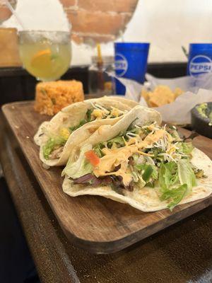 Fish tacos and passion fruit margarita. The plating is impressive!