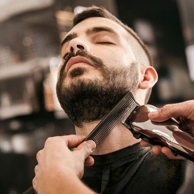 Traditional straight razor shave -- a precision grooming experience delivered by expert hands.