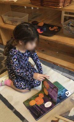 A young reader shined with confidence and curiosity, they explored their book and showed wonderful progress.