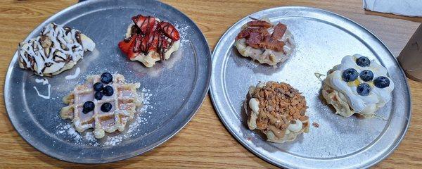 Shoes, Nutella Strawberry, glazed blueberry, maple bacon, butterfingers cheesecake, and lemon blueberry cheesecake mimi waffle flights