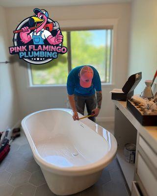 Pink Flamingo Plumbing installing a freestanding soaking tub for one of our happy customers!