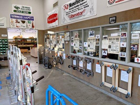 Our showroom wall with all the different 4-wheel dollies we carry.