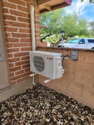 Mitsubishi single zone high efficient air conditioner, factory wall bracket.