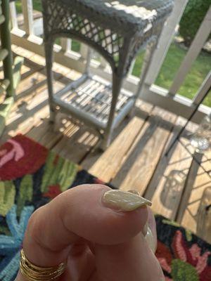 Edge of nail is chipped and cracks throughout