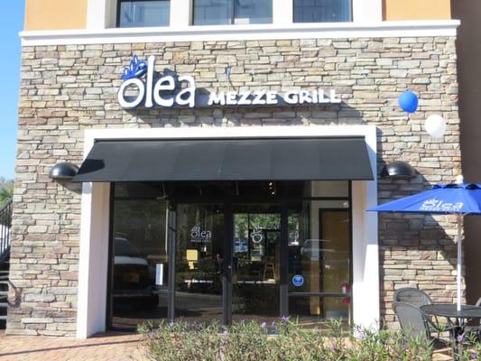 Parking lot entrance and a peak at the outdoor seating