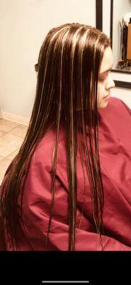 Long hair cut with blonde hilites