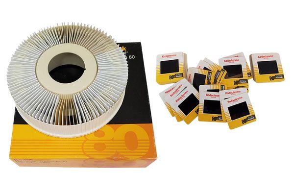 Stacks of slides taking up space, let us scan them and save the new digital files to a space saving flash drive.
