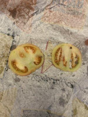 Green tomatoes on the burgers. Really?!? What junk.