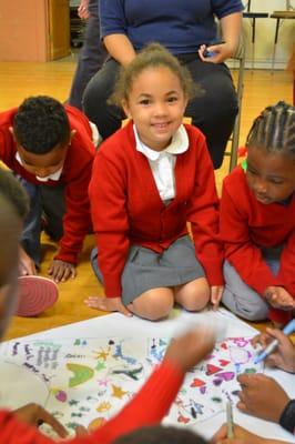 Students in Morning Circle illustrating their commitment to Peace during International Peace month.