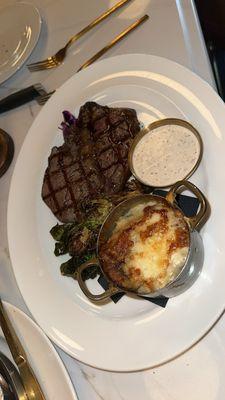 Ribeye with horseradish/black pepper sauce and au gratin potatoes