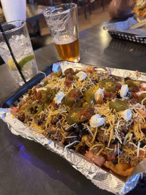 Idaho Nachos!! Great seasoning on crispy waffle fries topped with all the nacho classics