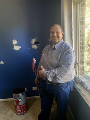 Preparing the room for paint.