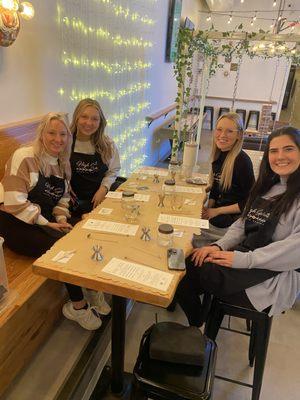 Four friends at a candle pour in Lakewood, Ohio